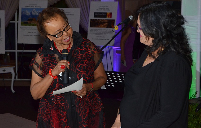 Co-Chairwoman Jacqueline Ray tells the story of Children First client Eliabel Ramirez while the two stand on the dance floor together before dinner at Fairytale Ball on March 25 at Michael’s On East.