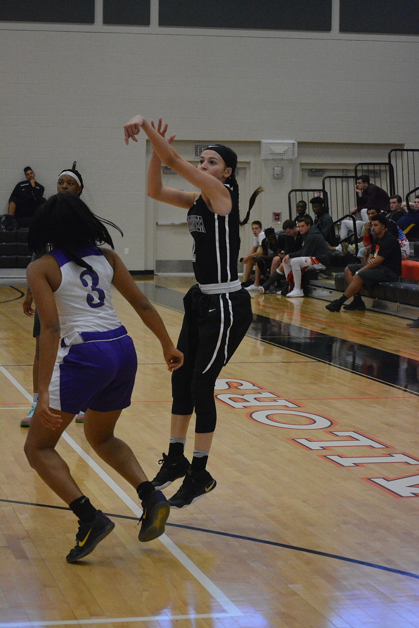 Braden River'  s Bailee Steury takes a three-pointer in the girls game.