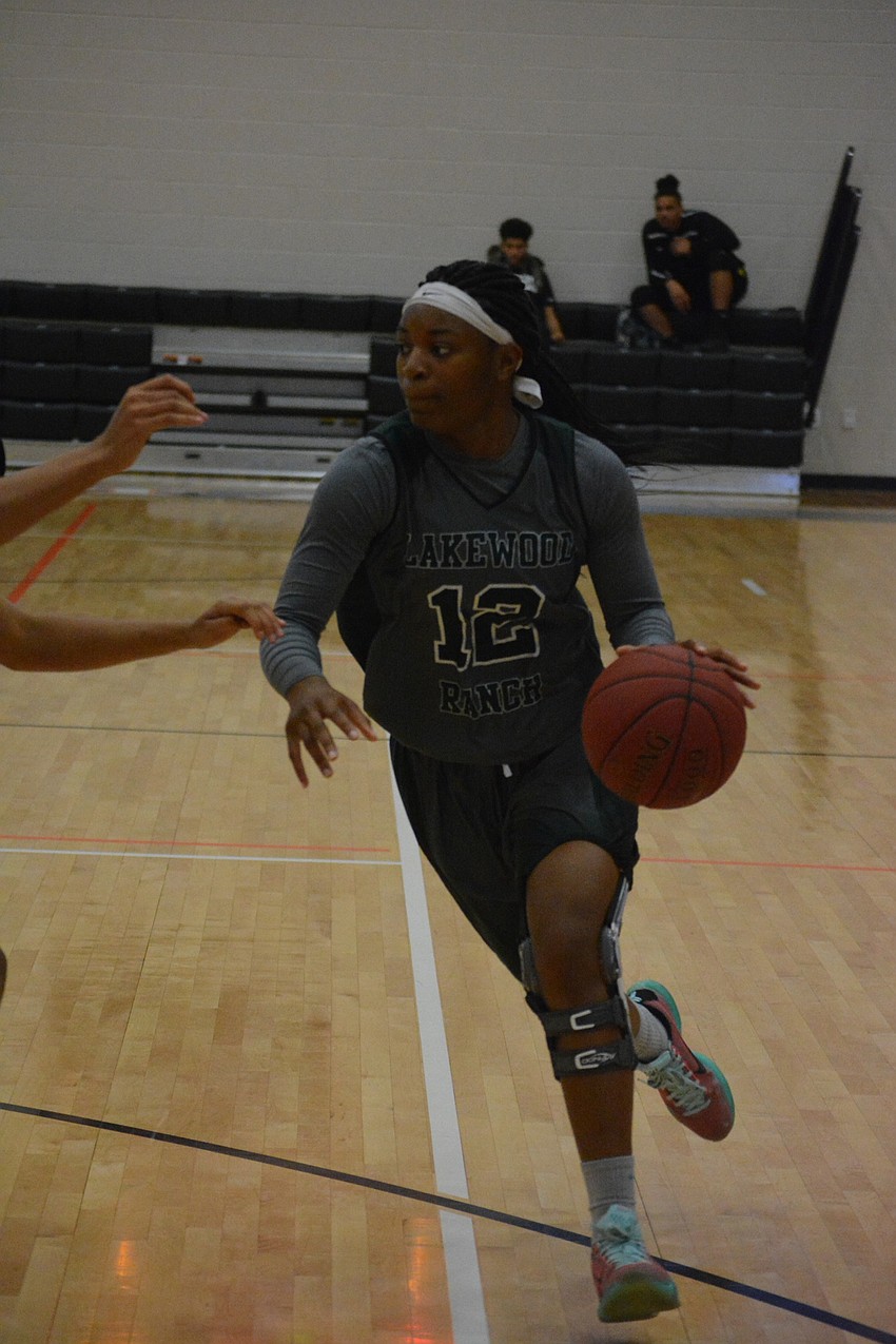 Lakewood Ranch'  s Aleah Robinson drives to the hoop in the girls game.