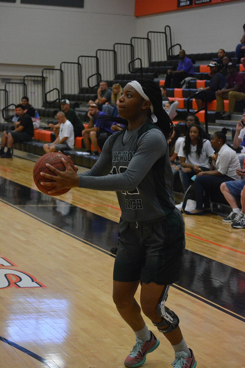 Lakewood Ranch'  s Aleah Robinson lines up a three-pointer in the girls game.