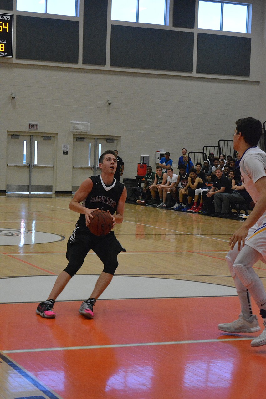 Braden River'  s Curtis Cobb pulls up for a jumper during the boys game.