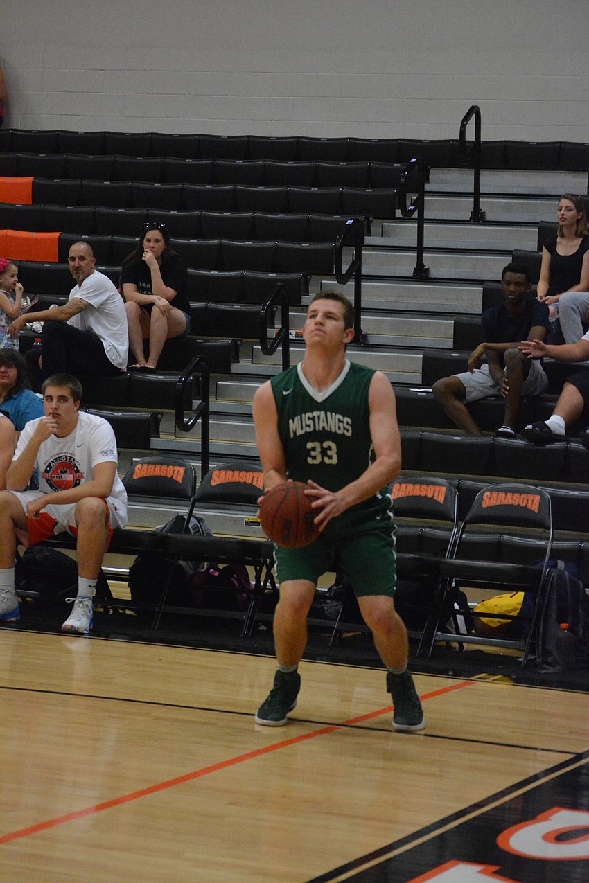 Lakewood Ranch'  s Justin Muscara gets a wide-open three-pointer during the boys game.