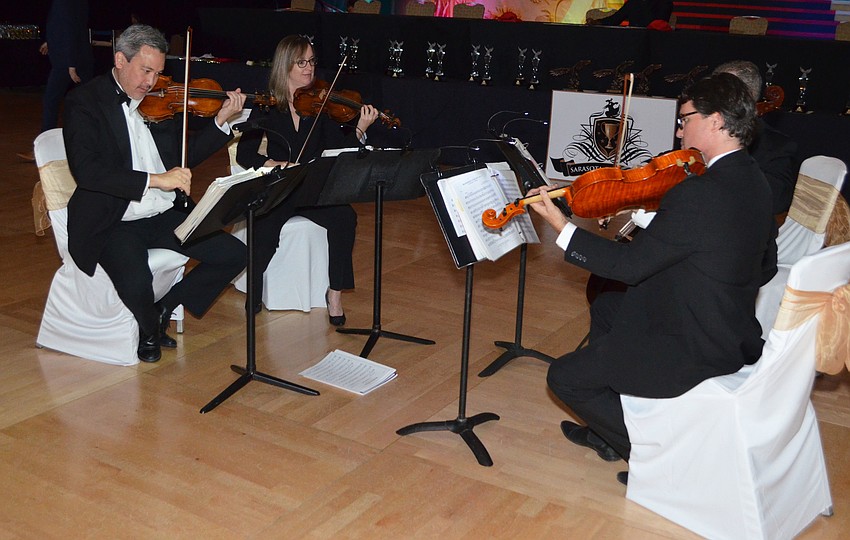 A string quartet serenaded guests with chamber music during dinner at Sarasota Challenge on March 26 at Hyatt Regency Sarasota.