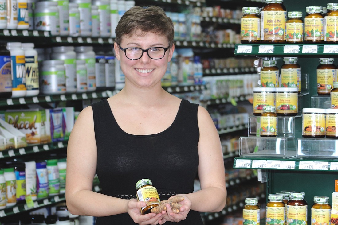 Order Manager at Healthy Living Organic and Natural Market Sydnie Petteway holds the store most trendy item: turmeric.
