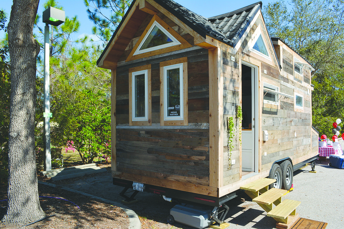 Tiny houses like this one are very popular. Stock art.