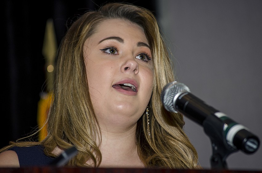 Teen Court Volunteer of the Year Megan Clouden introduces keynote speaker Nora Demleitner.