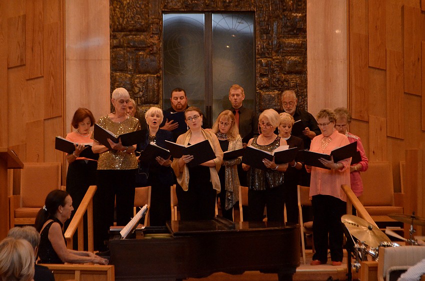 The choir began the concert by singing “L’D’or Va Dor.”