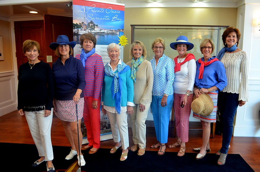 The female models strike a pose before they hit the runway.