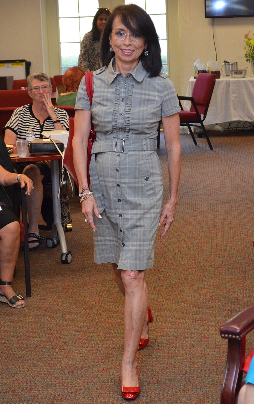 Marieste Emura struts her stuff in a Burberry London frock available at Designing Women Boutique during the style show on March 30 at Designing Women Boutique.