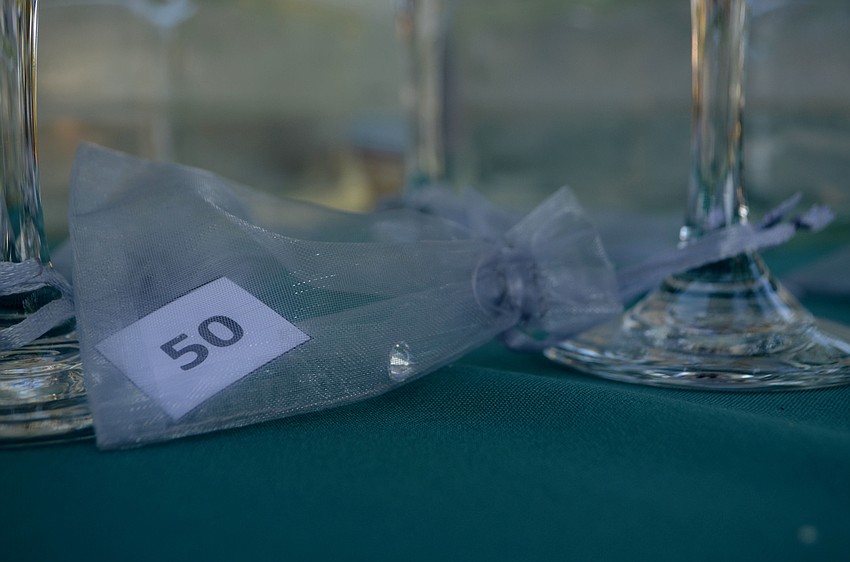 Ninety nine of the champagne glasses in “Glitz in a Glass” had cubic zirconium attached, but one lucky glass had a one-carat diamond.