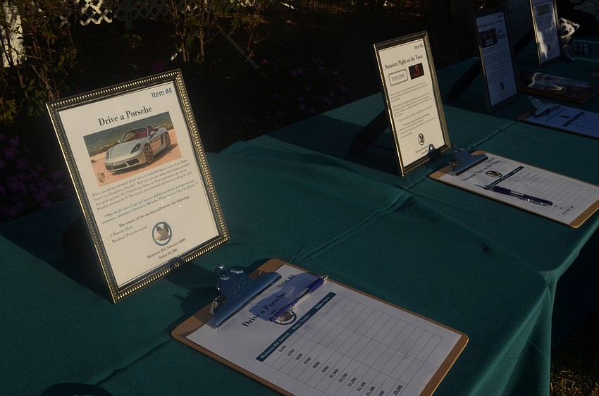 During cocktail hours, seabird supports could bid on various silent auction items, such as a weekend Porsche rental.
