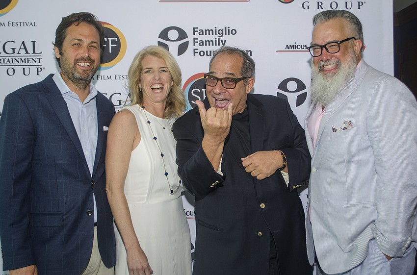 Mark Bailey, Rory Kennedy and Michael Dunaway laugh as Sarasota Film Festival President Mark Famiglio makes the hang ten sign in honor of Kennedy'  s film, 