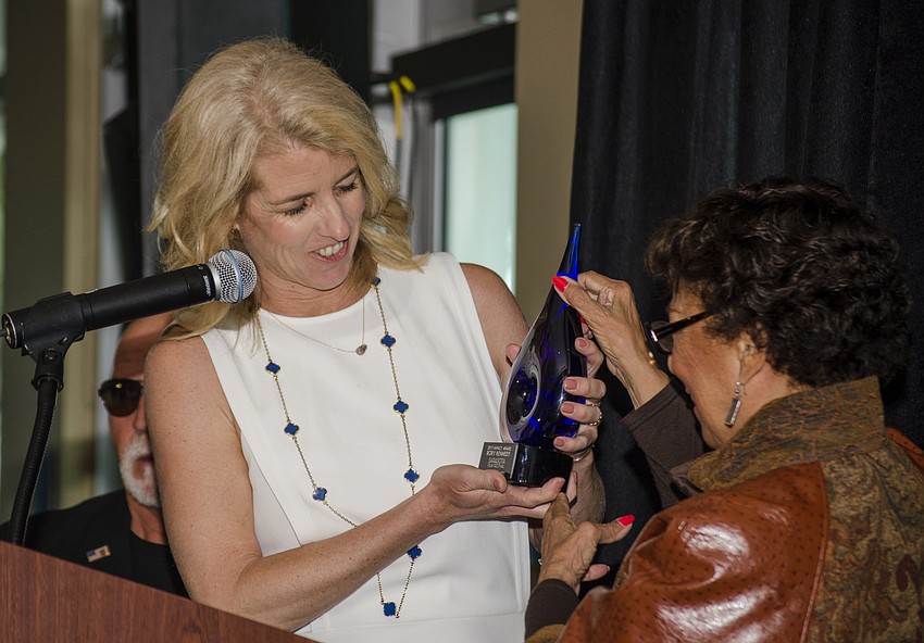 Rory Kennedy accepts the USNC UN 2017 Impact Award at the At Lunch with Rory Kennedy event.