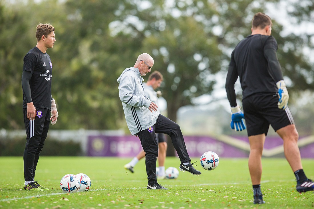 Tim Mulqueen kicks a ball into the air while working with Orlando City SC goalkeepers. Courtesy photo.