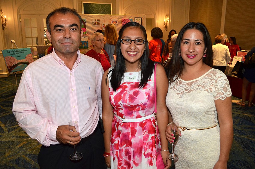 Aslan Simsek, Leadership Award winner Alex Perez and Ruth Simsek