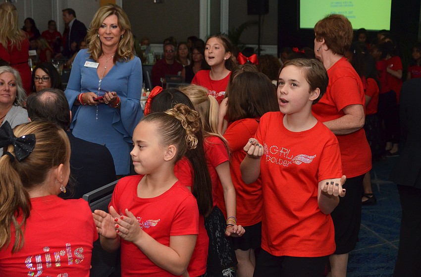Girls Inc. of Sarasota County participants goof off while waiting to go onstage for a choir performance at the 29th Annual Girls Inc. Celebration Luncheon: Girl Power on March 31 at The Ritz-Carlton, Sarasota.