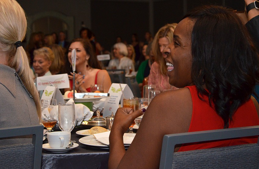 Tomeika Koski laughs while singing along to Rachel Platten’s “Fight Song” during a performance by the Girls Inc. of Sarasota County choir at the 29th Annual Girls Inc. Celebration Luncheon: Girl Power on March 31 at The Ritz-Carlton, Sarasota.