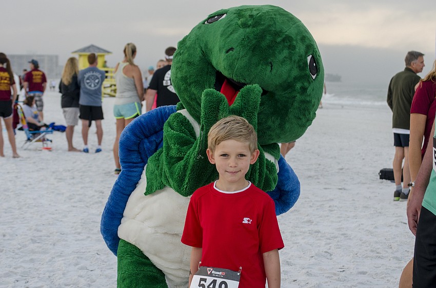 Michael Kedroff poses with Shelley the Sea Turtle.