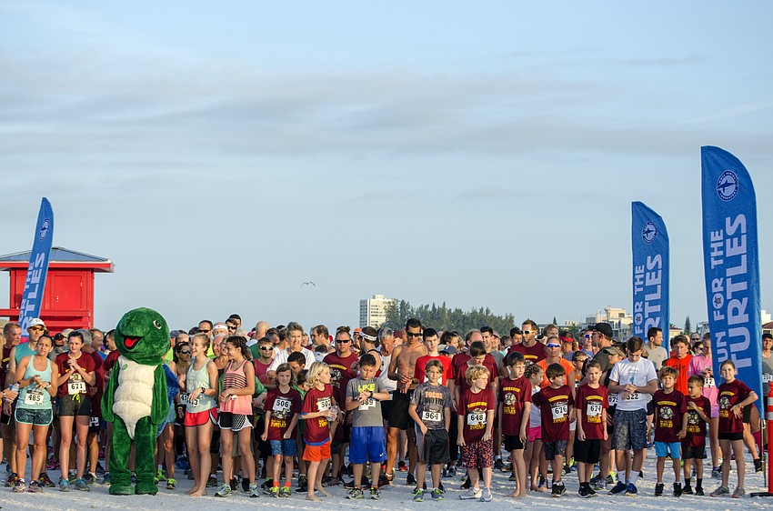 Runners line up on the starting line of the 31st annual Run for the Turtles.