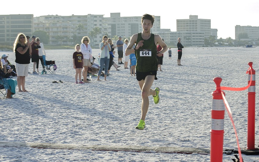 Alex Milne was the first to cross the finish line of the 31st annual Run for the Turtles.