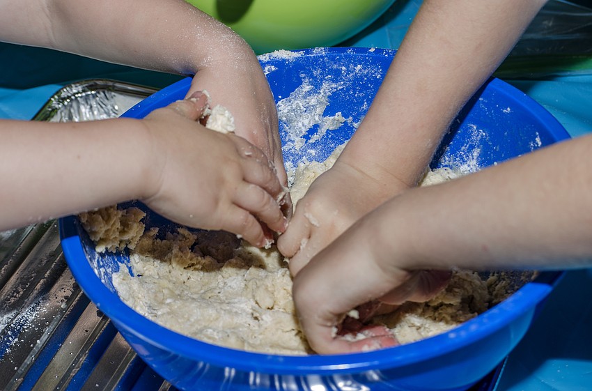 Families prepared their own challah dough at the challah workshop at Temple Emanu-El.