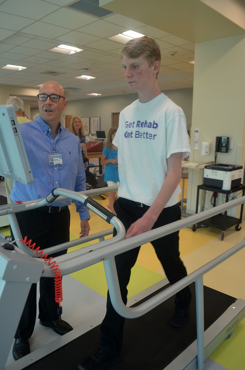 Physical therapist Jim Caron and Tyler Klingel demonstrate how the Biodex Treadmill works.