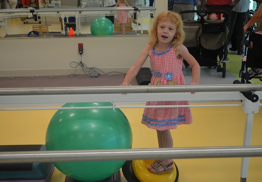 Eloise Doepker, 5, tests out some of the new equipment.