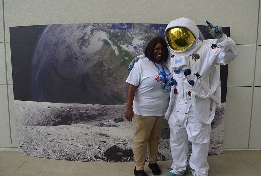 Tonia Thompson, a coding quality specialist, and Mustafa Ozkan, a CRM Market Analyst and resident astronaut for the grand opening