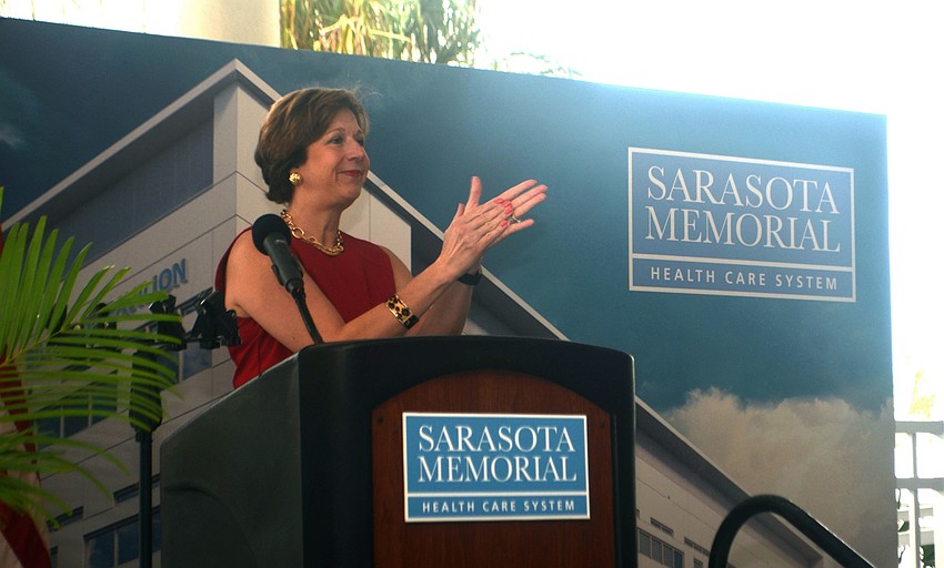 Chief Operating Officer Lorrie Liang claps as she welcomes Ana Gonzalez, a former patient, to the stage to share her story.