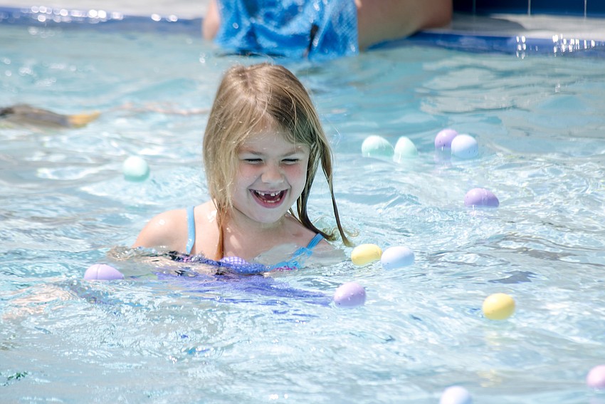 Caitlin Encke participates in an Arlington Park Spring Splash  egg hunt.