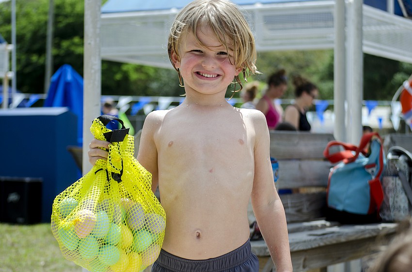 Kane Bennette shows off the eggs he collected in one of the egg hunts during the Arlington Park Spring Splash.