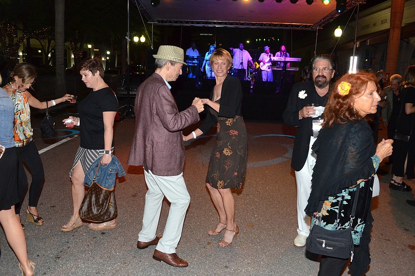 Guests dance during Jah Movement’s performance at the event on March 31 outside the Sarasota Opera House.