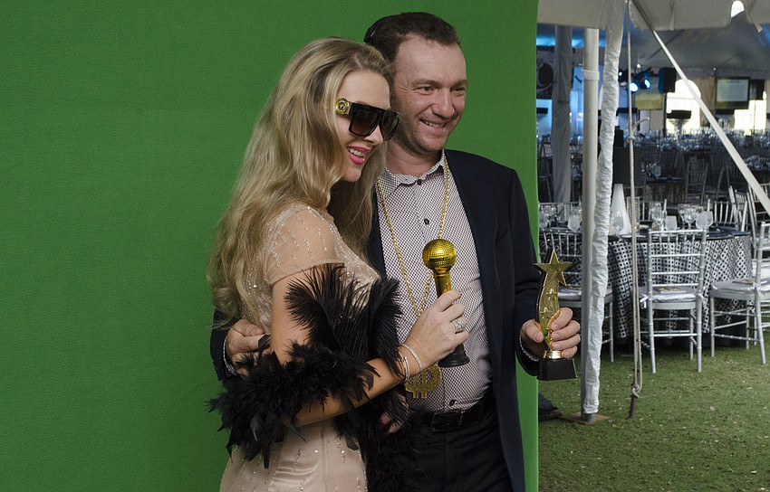 Lenka and Ales Graf pose in the Hello Gorgeous photo booth at Firefly Gala on April 1 at The Ritz-Carlton Members Golf Club.