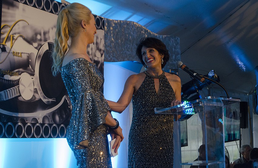 Chairwoman Ariane Dart is recognized by Forty Carrots Family Center Executive Director Michelle Kapreilian at Firefly Gala on April 1 at The Ritz-Carlton Members Golf Club.