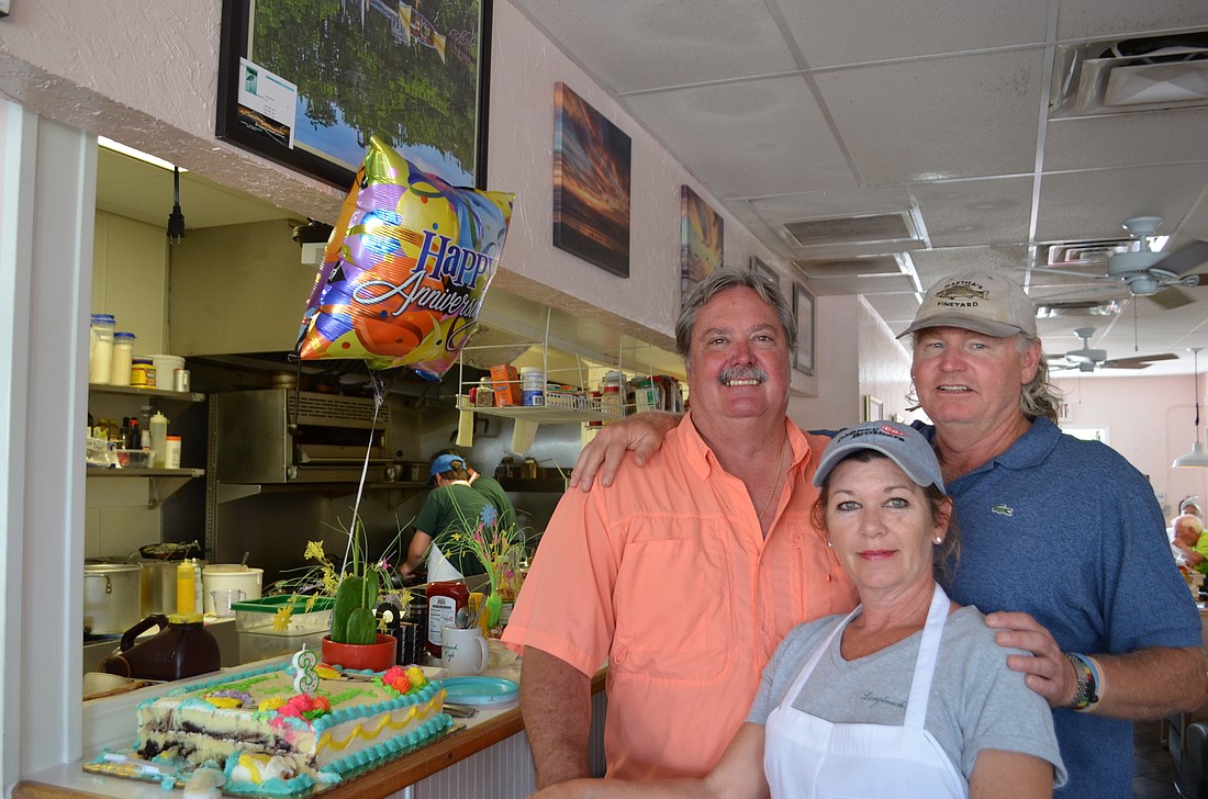 Longbeach Cafe co-owners Pete Collandra, Colleen Collandra and Jeff Daly celebrated three years in business on Sunday.