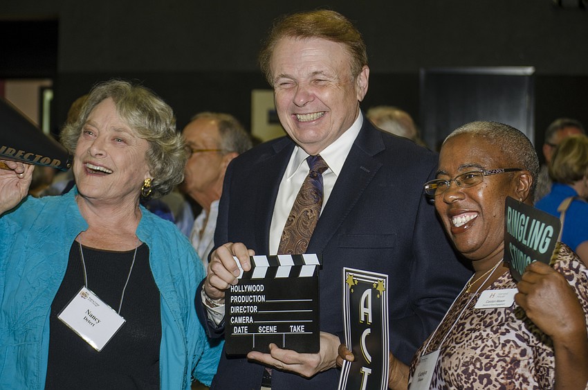 Sarasota County Commissioner Nancy Detert, Ringling College of Art and Design President Larry Thompson and Carolyn Mason pose for a photo at the ribbon cutting for the college' s newly completed soundstage.