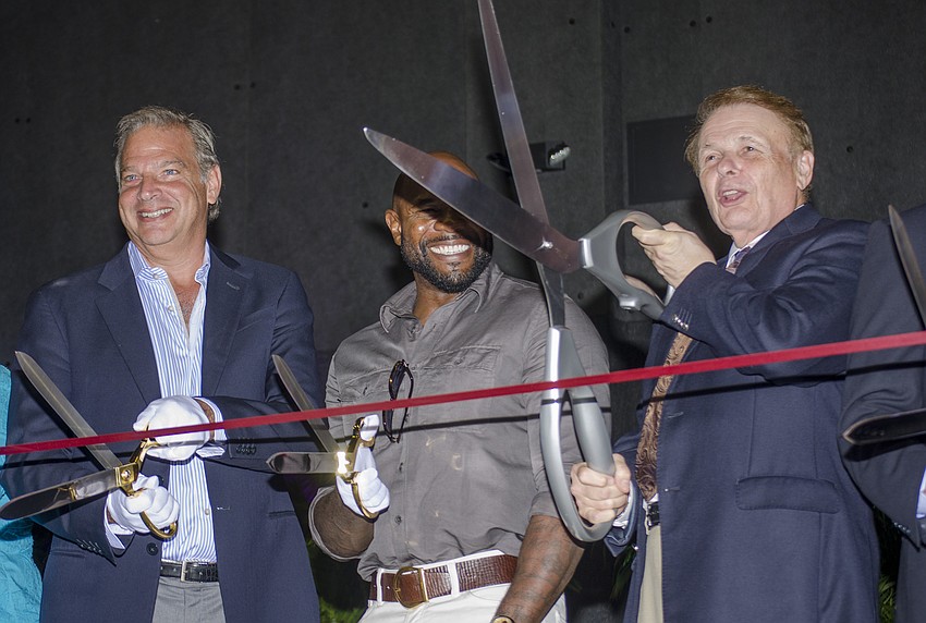 Chairman Dean Eisner, director Antoine Fuqua and Ringling College of Art and Design President Larry Thompson cut the ribbon on the new soundstage.