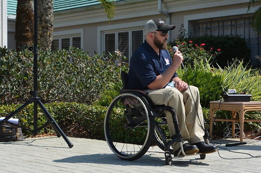 Carl Moore addresses more than 150 golfers before the event. 