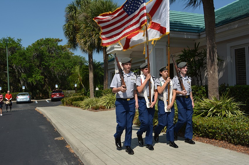 Freshman Camrin Suggs, senior Kaley Gee, junior Alexander Fallacaro and senior Tom Fraser of Lakewood Ranch High JROTC program present the colors.