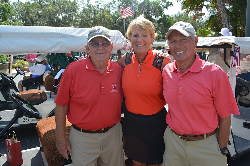 Dolph Weissenberg and Gail and Mike Zinn get ready to hit the links. 