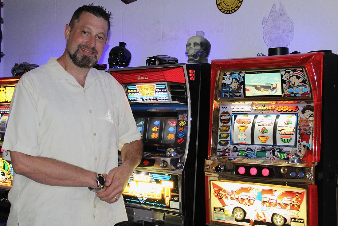 Lakewood Ranchâ€™s Jay Scheck hangs out in his man cave with his collection of Japanese slot machines.