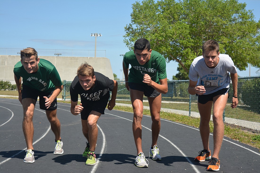 Andrew Dean, Brice Easton, John Rivera and Johnny Reid get in a running stance.