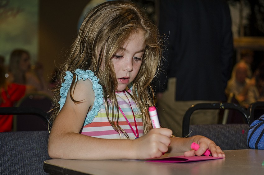 Celia Collier colors a card for Sue Huntting.