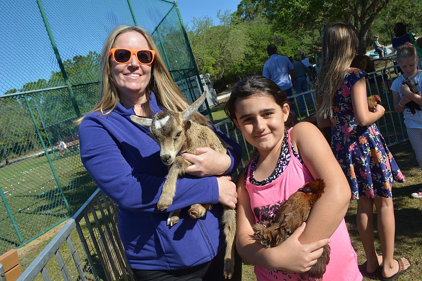 Jenifer Dodson and Lana Ebrahimpour, of Lakewood Ranch, make a stop at the petting zoo.