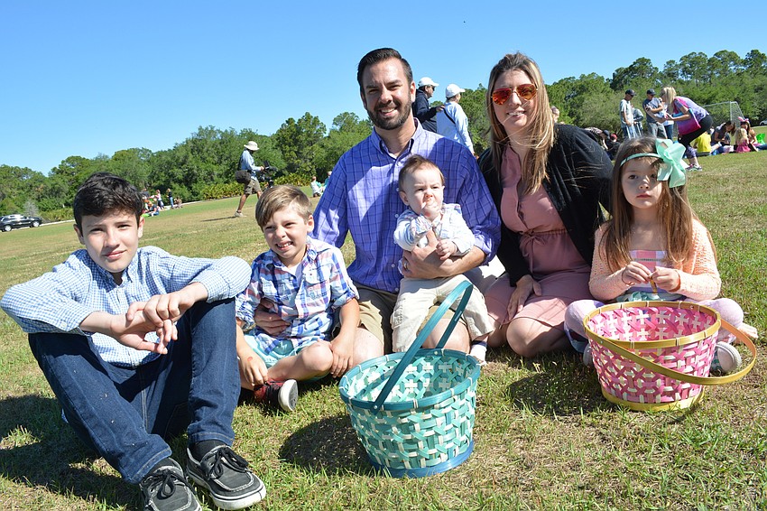 The Arbanas family, of Greenbrook, sorts through eggs after the hunt. Pictured are: Trenton, Jude, Andrew, Jaxson, Tiffany and Aryella.