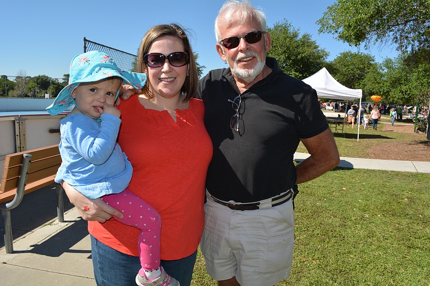New York' s Laura Darman with her daughter, Julia, left, attend while visiting Laura' s dad, Country Club West' s Wayne Turnblom.