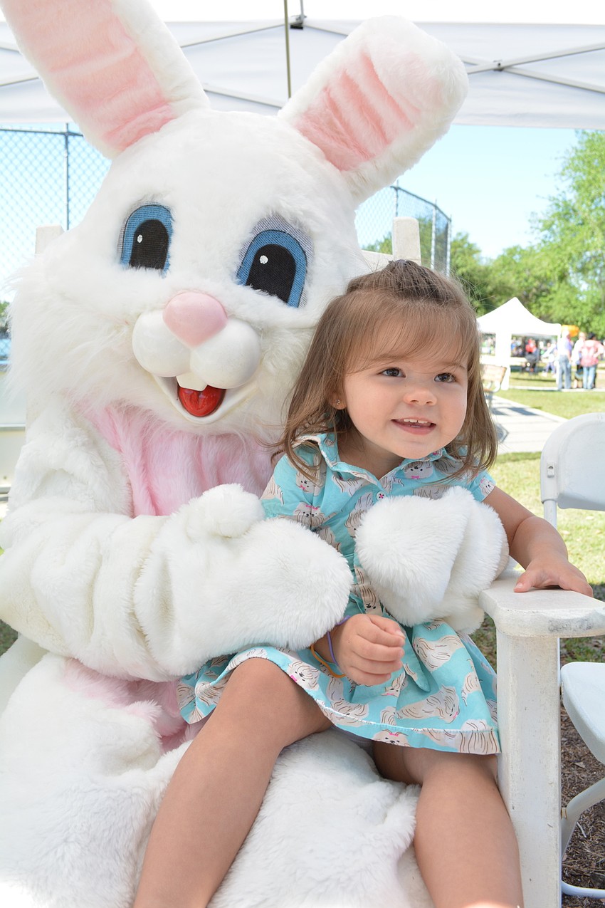 Lakewood Ranch' s Charlotte Roth enjoys visiting with the  Easter Bunny.