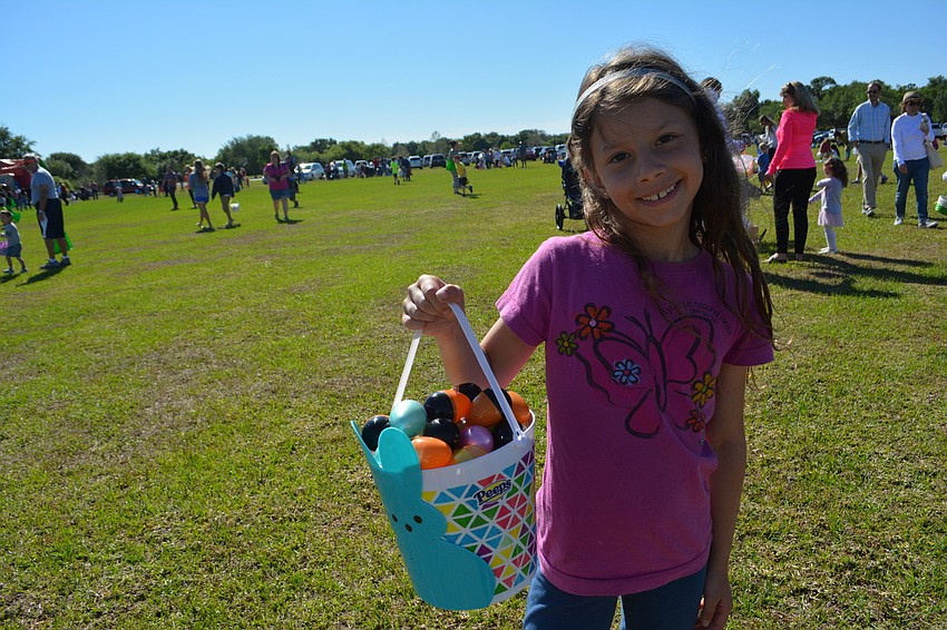 Lakewood Ranch' s Madeline Arsenault, 8, shows off her egg haul.