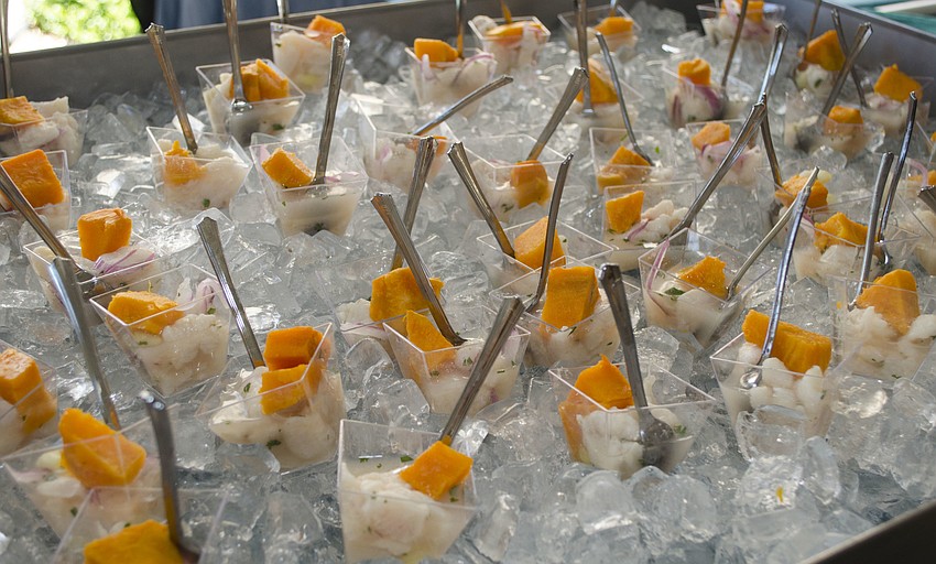 Employees from H20 Bistro at Hotel Indigo served ceviche topped with sweet potato at the Florida Winefest & Auction Grand Tasting, Brunch and Charity Auction on April 8 on the grounds of the Van Wezel Performing Arts Hall.