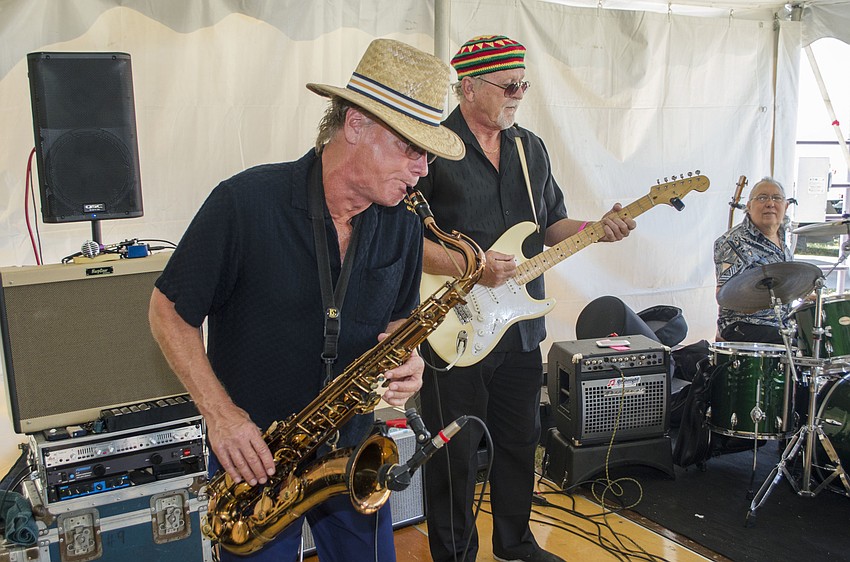 Members of Kat Crosby Band perform at Wine on the Water on April 9 on the grounds of Van Wezel Performing Arts Hall.
